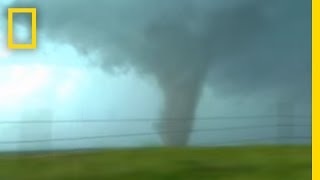 Tornadoes Lightning in Rare Video  National Geographic [upl. by Jillie151]