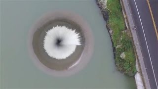 Drone Films Lake Overflowing Into California Spillway [upl. by Scrivenor]