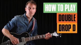 How to Play Double Drop D Tuning  Guitar Tricks [upl. by Welbie]